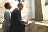 Obama signs visitor's book at Taj Hotel