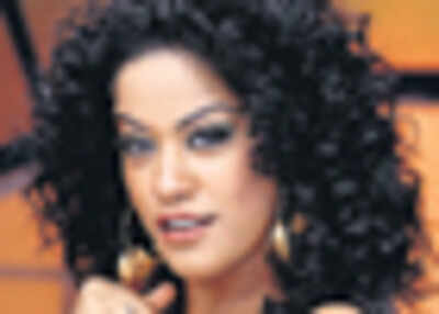 Mumaith Khan as snake woman