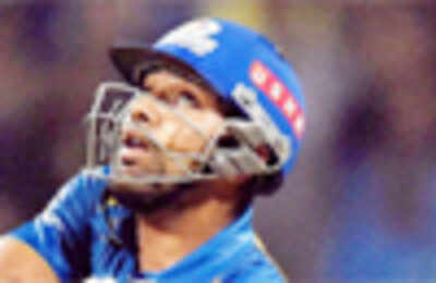 Rohit guides Mumbai Indians to 141/5 against KKR